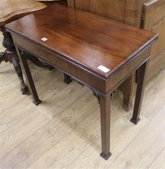 A George III mahogany card table W.84cm.